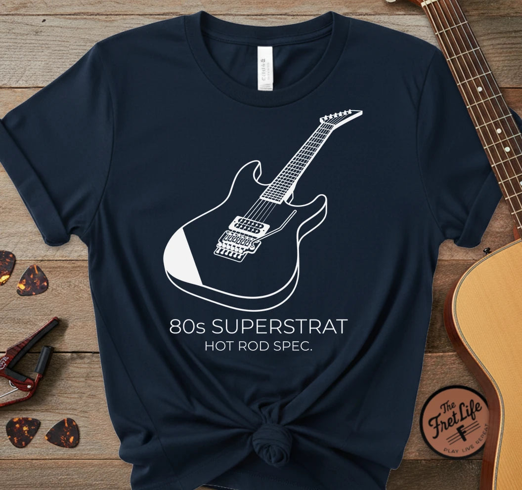 https://wescale-cdn.com/generated-mockups/06643e60-6f9f-4676-8a50-5fdfdc8f17c0/3a9605ae-e815-4cfe-83f8-b635bd7419a0/9df8555b-60e8-4f47-b165-76740c0d01cb_designs/80s_superstrat_white_1774975403469_f17ft8.png_1774975404223.webp