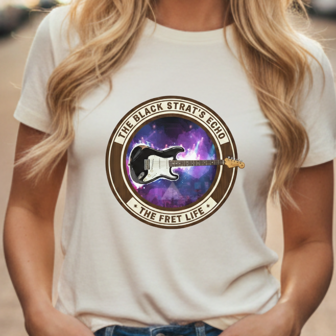 Person wearing a white t-shirt with a guitar graphic and text design.