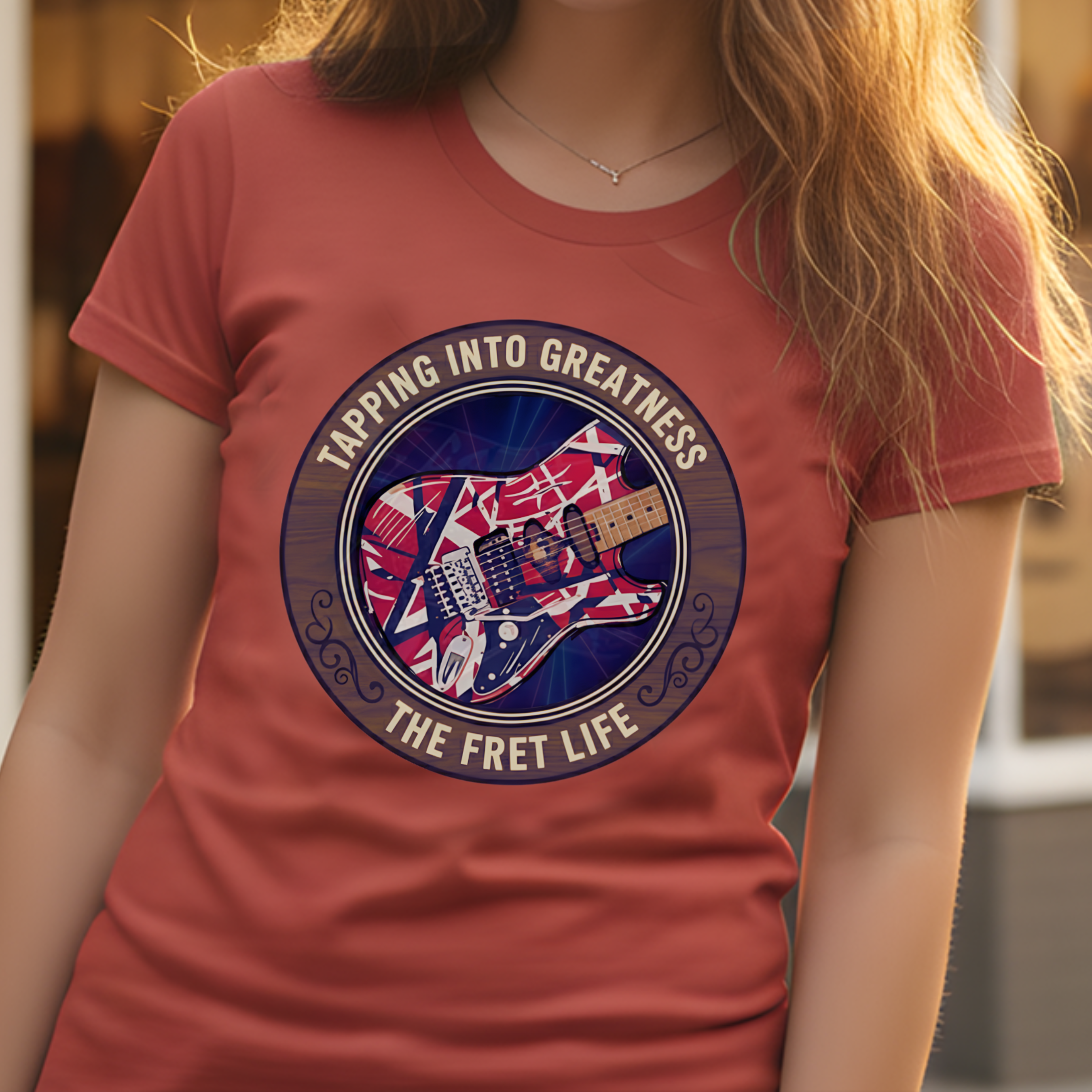 Person wearing a red t-shirt with a guitar graphic and text