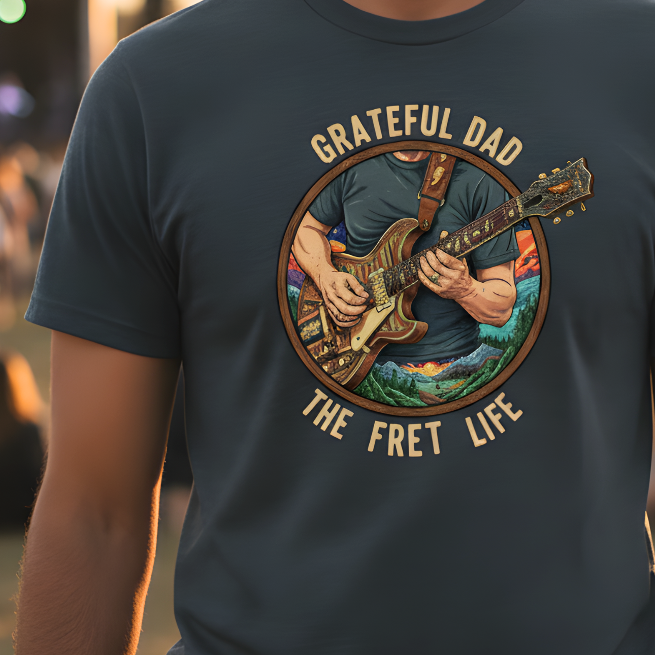 T-shirt with a graphic of a person playing guitar and text 'Grateful Dad The Fret Life' on a dark background.
