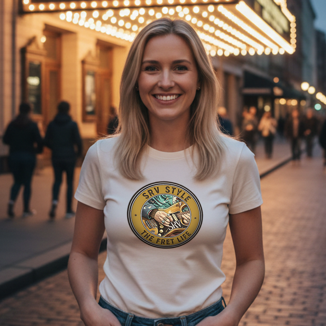 Woman wearing a white t-shirt with a logo and text, standing on a city street at night.