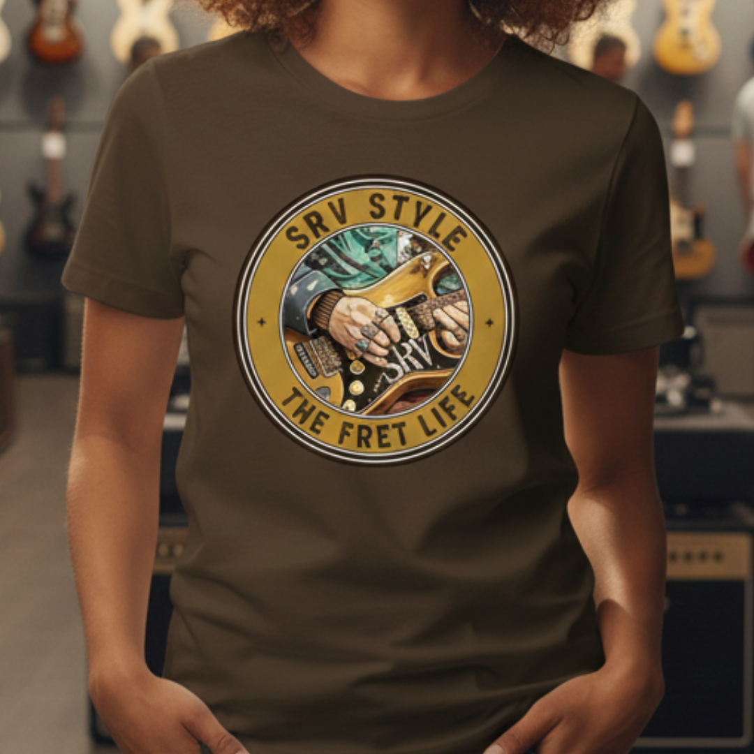 Person wearing a brown t-shirt with a guitar-themed graphic and text in a music store.