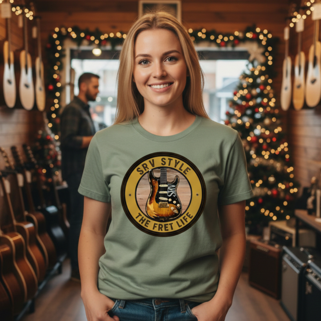 Woman wearing a green t-shirt with a guitar graphic in a music store.