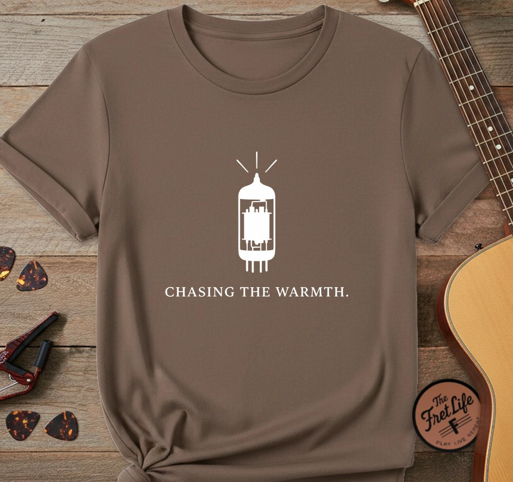 https://wescale-cdn.com/generated-mockups/06643e60-6f9f-4676-8a50-5fdfdc8f17c0/95c6ccee-668c-484f-a77b-49edc5ba2269/1a6178eb-9525-4c97-8f5b-982608e4a573_designs/chasing_the_warmth_white_1775677669814_w9qctq.png.webp