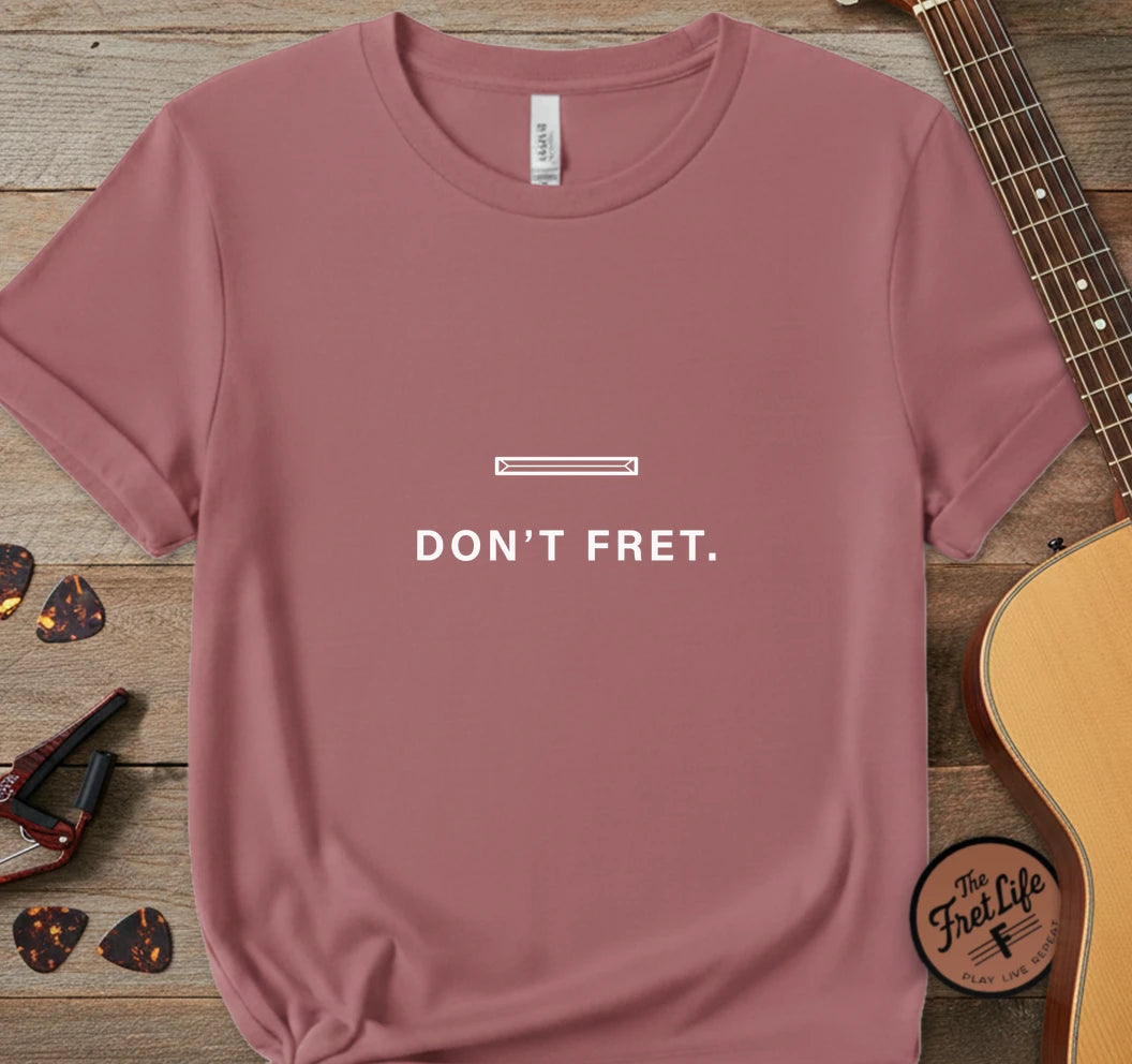 https://wescale-cdn.com/generated-mockups/06643e60-6f9f-4676-8a50-5fdfdc8f17c0/95c6ccee-668c-484f-a77b-49edc5ba2269/bcf3ec2e-f6a0-47a5-b3e4-d6f65d421eb7_designs/don_t_fret_white_1775678204134_12kxtg.png.webp