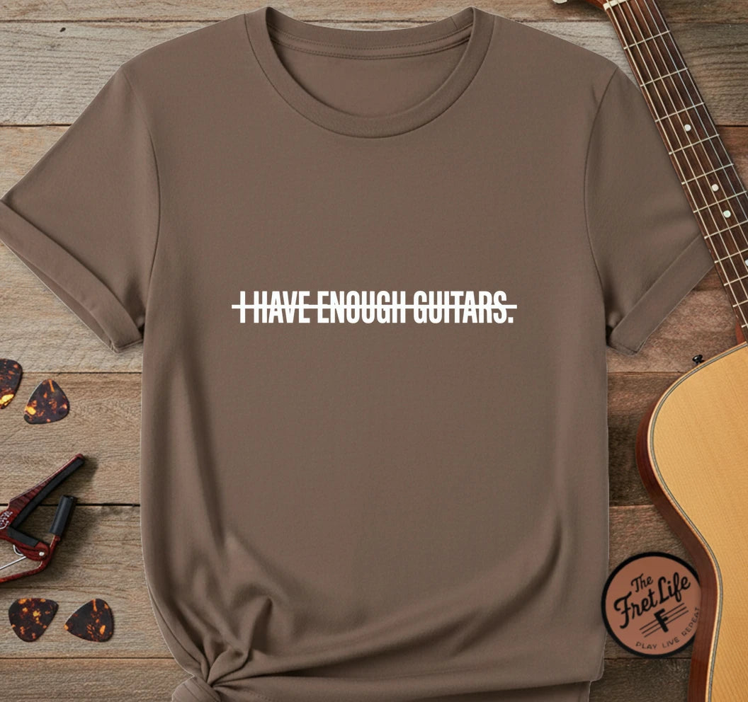https://wescale-cdn.com/generated-mockups/743ebdcc-3fc9-40e2-b9d5-dd757f1a24dd/ecd01f76-a5aa-4437-88a6-1b7784d9e0c8/19c70d80-8bce-4066-9a44-acd77fcaa1a4_designs/enough_guitars_white_1776720199622_awtcrc.png.webp