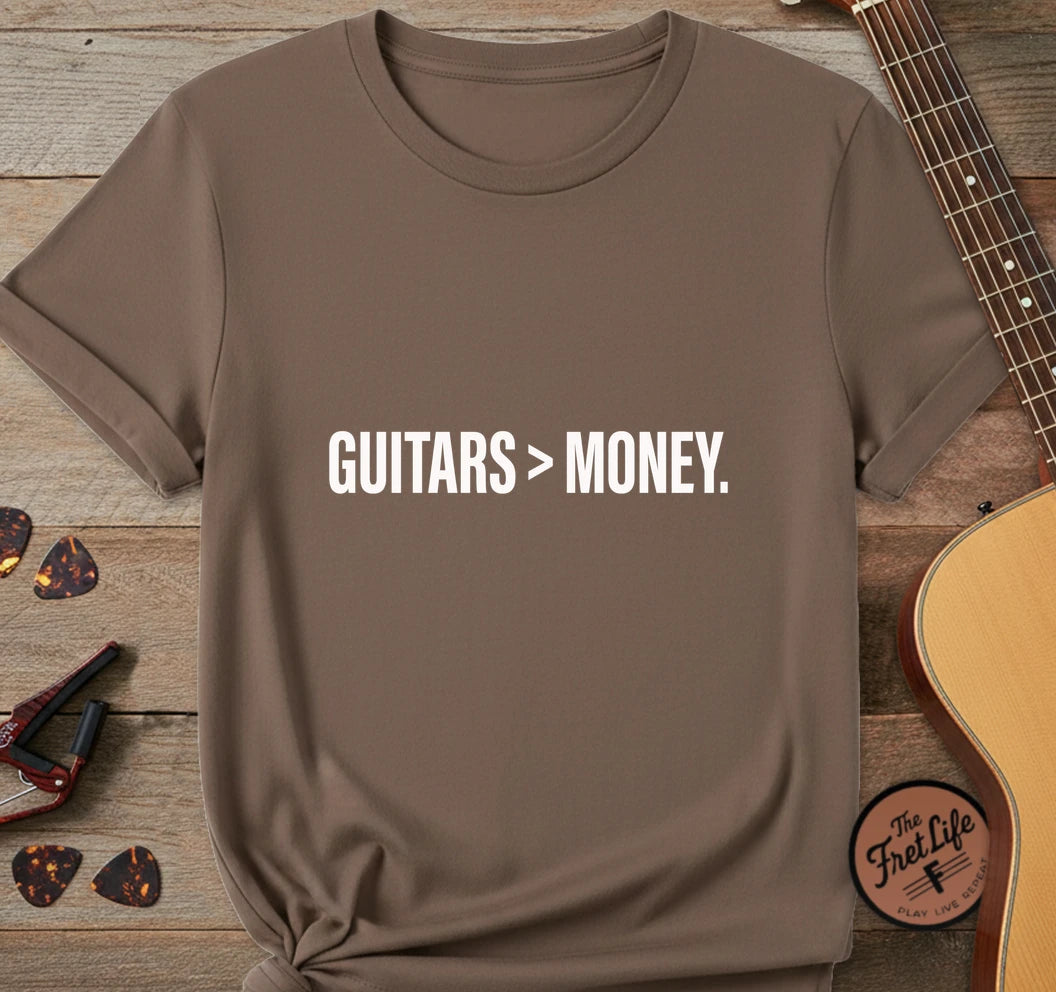 https://wescale-cdn.com/generated-mockups/743ebdcc-3fc9-40e2-b9d5-dd757f1a24dd/334a8ed6-304d-4046-8a95-21ba10cae732/19c70d80-8bce-4066-9a44-acd77fcaa1a4_designs/guitars_money_white_1776715770906_j4r299.png.webp