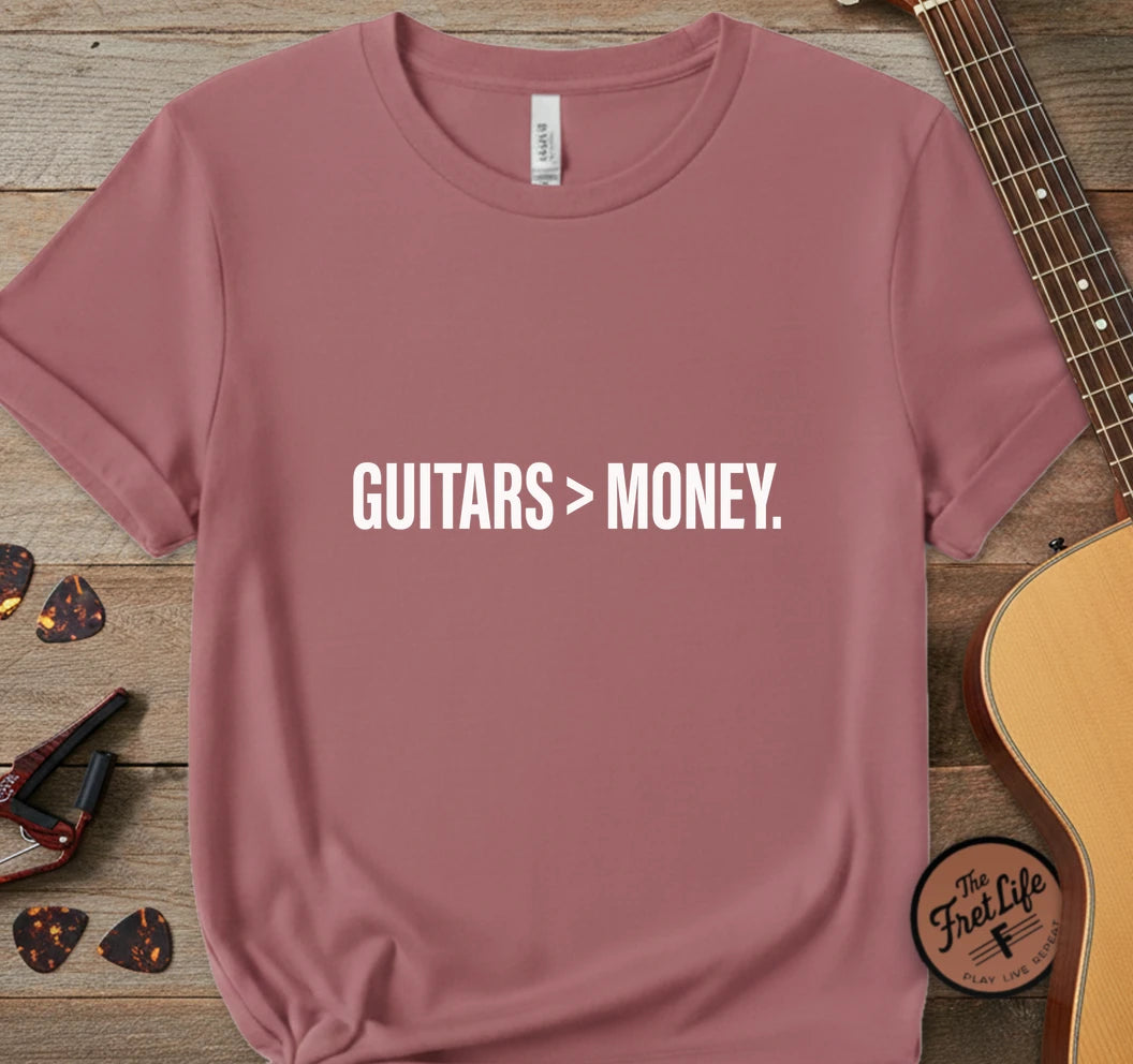 https://wescale-cdn.com/generated-mockups/743ebdcc-3fc9-40e2-b9d5-dd757f1a24dd/334a8ed6-304d-4046-8a95-21ba10cae732/f881f874-08a9-4e30-915e-22f2763cc809_designs/guitars_money_white_1776715770906_j4r299.png.webp