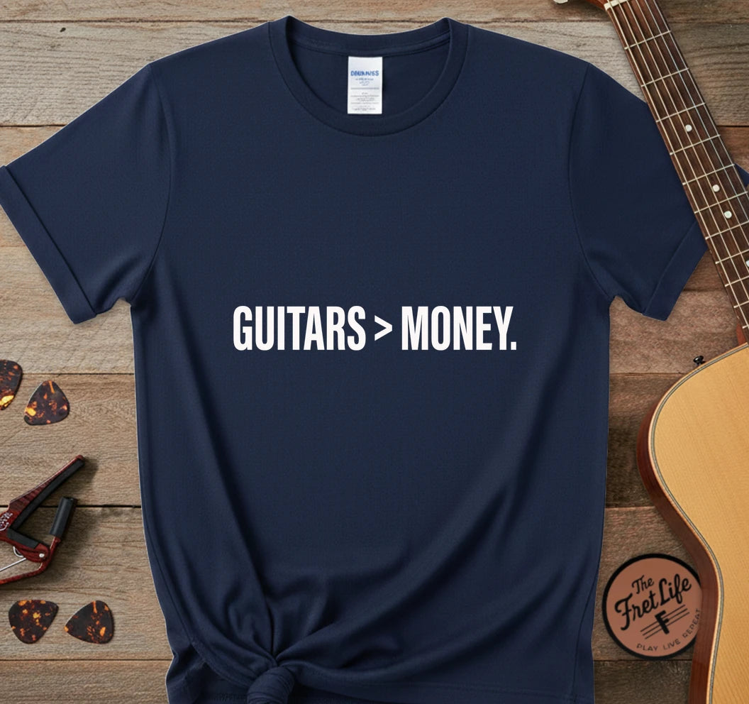 https://wescale-cdn.com/generated-mockups/743ebdcc-3fc9-40e2-b9d5-dd757f1a24dd/334a8ed6-304d-4046-8a95-21ba10cae732/31c0e680-d30a-4281-8de3-d192e1063842_designs/guitars_money_white_1776715770906_j4r299.png.webp
