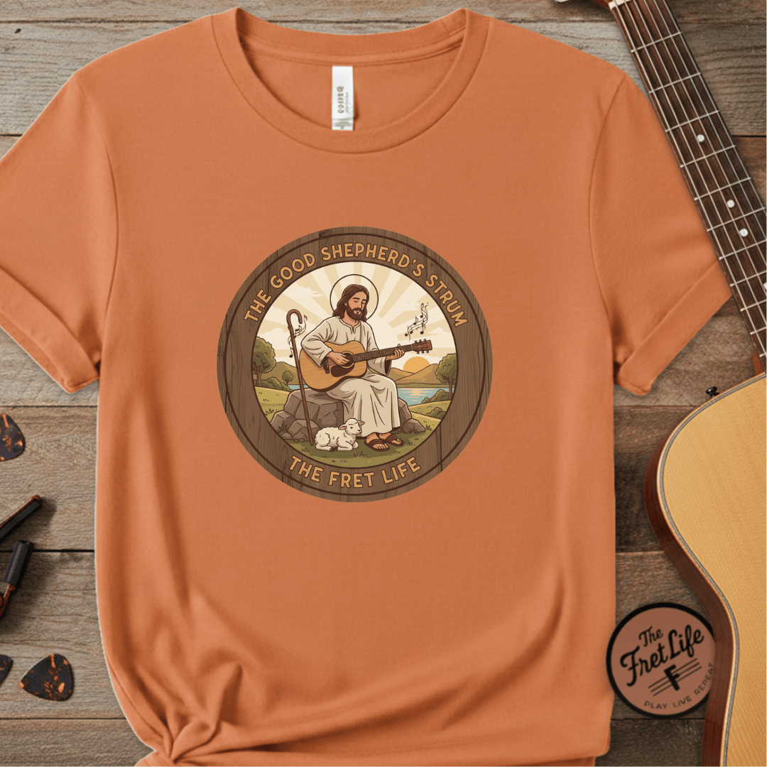 Printify T-Shirt Burnt Orange / S The Good Shepherd's Strum T-Shirt: Led by the Ultimate Musician.