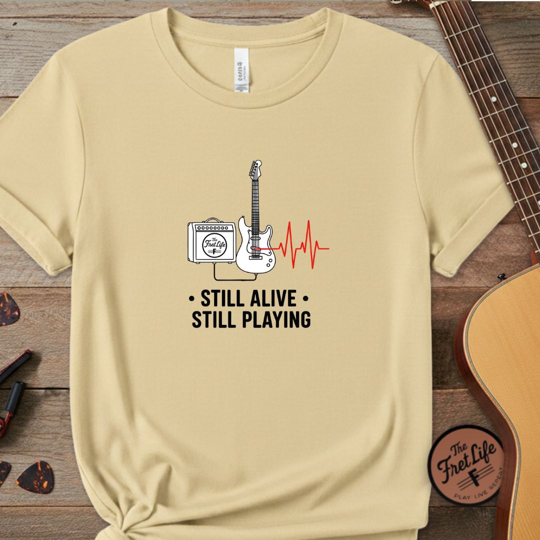 Printify T-Shirt Butter / S Still Alive, Still Playing | Premium T-Shirt